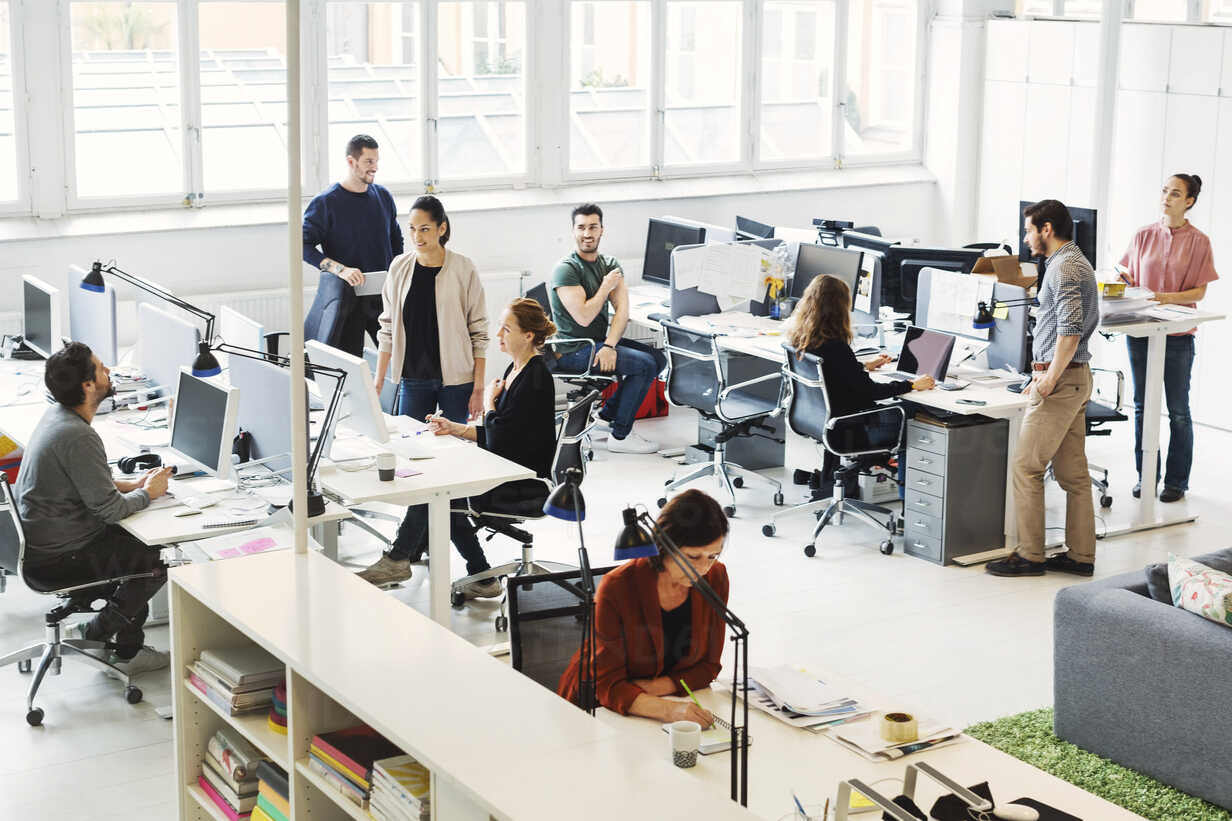 high-angle-view-of-business-people-working-in-modern-office-MASF04304